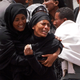 Distraught family members attend a memorial service held for the victims of the Ethiopian Airlines Flight ET302 crash on March 14, 2019, in Ejere, Ethiopia.